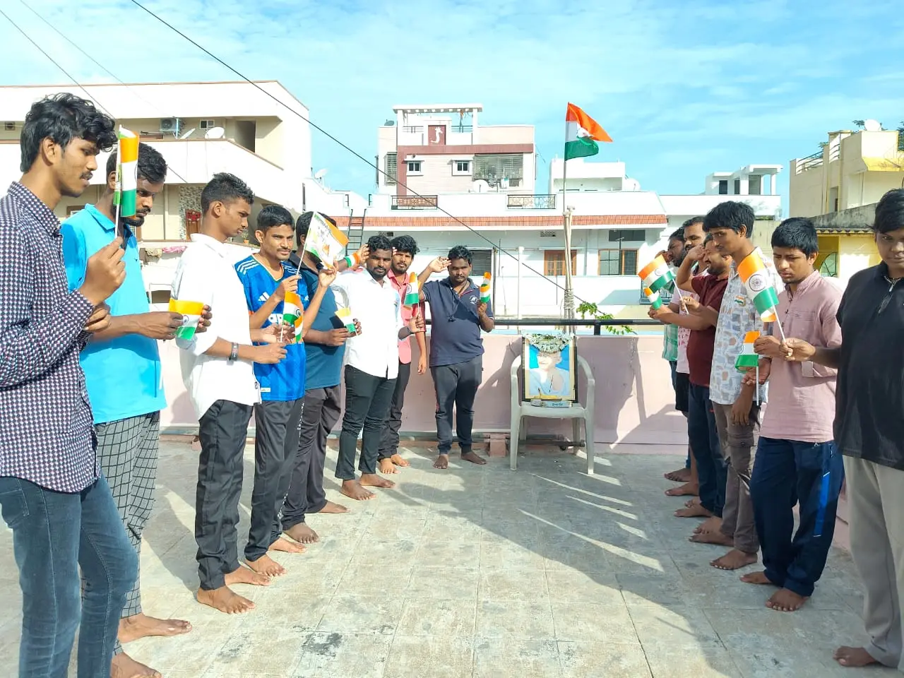 Residents raising the Indian flag on the terrace for Independence Day